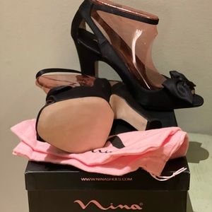 New never worn with dust bag. Black Nina peep toe pumps with 3 inch block heel.